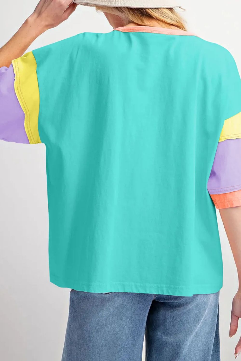 Raglan tee with colorblock sleeves in purple, yellow, and teal with a coral neckline.