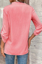 Red and white vertical stripe blouse with rolled sleeves and a V-neck.
