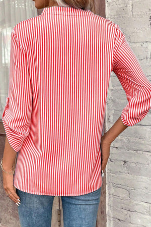 Red and white vertical stripe blouse with rolled sleeves and a V-neck.