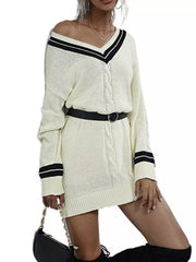 Beige V-neck cable knit sweater dress with black striped trim and a black belt.