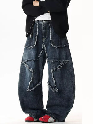 Dark wash wide leg jeans with star patchwork and distressed frayed details.