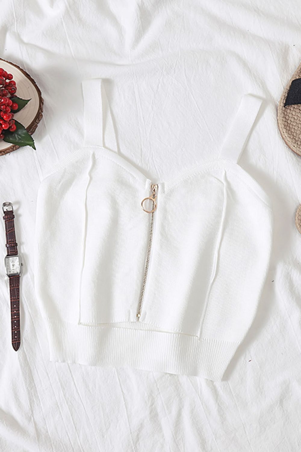 White ribbed knit crop top with exposed zip detail and ring pull.