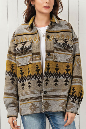 GeoChic collar jacket in camel with geometric pattern and chest pockets.