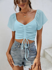 Pastel blue ribbed crop top with chiffon sleeves and adjustable drawstring.