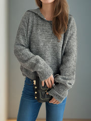 Textured knit polo sweater in dark gray with ribbed details and a relaxed fit.