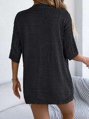 Black open-knit three-quarter sleeve cardigan with cable-knit detail on sleeves