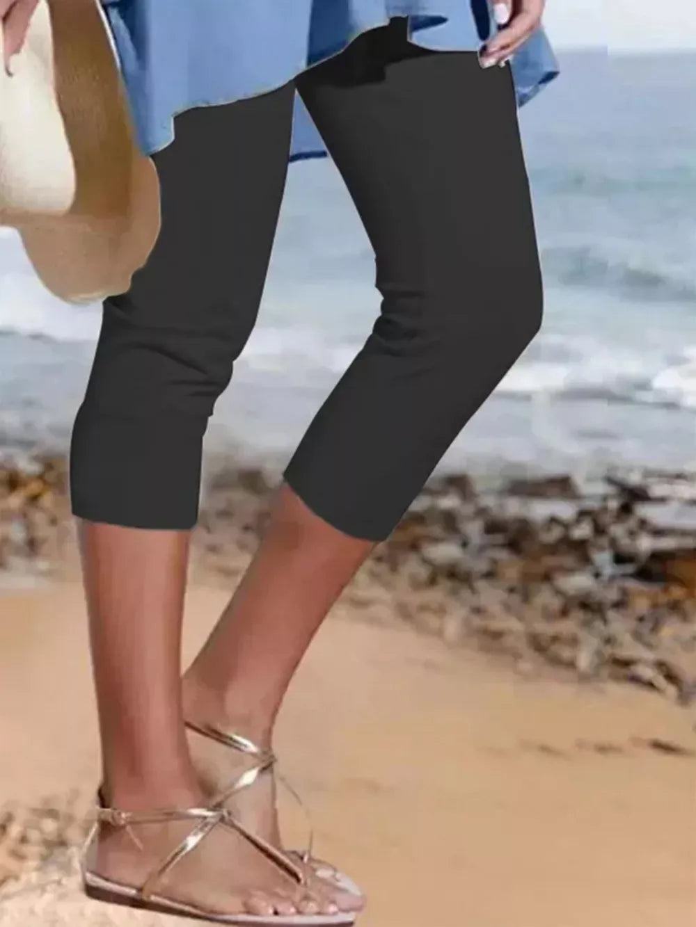 Black cropped leggings with a casual fit, perfect for activewear.