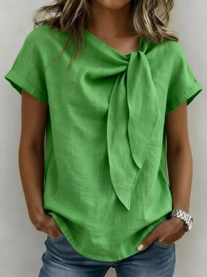 Green bow-tie neck relaxed fit shirt with short sleeves.