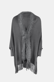Charcoal faux fur trimmed fringe cape with a V-neck detail.