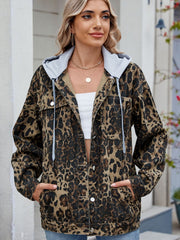 Leopard print denim shacket with removable grey hood and button front.