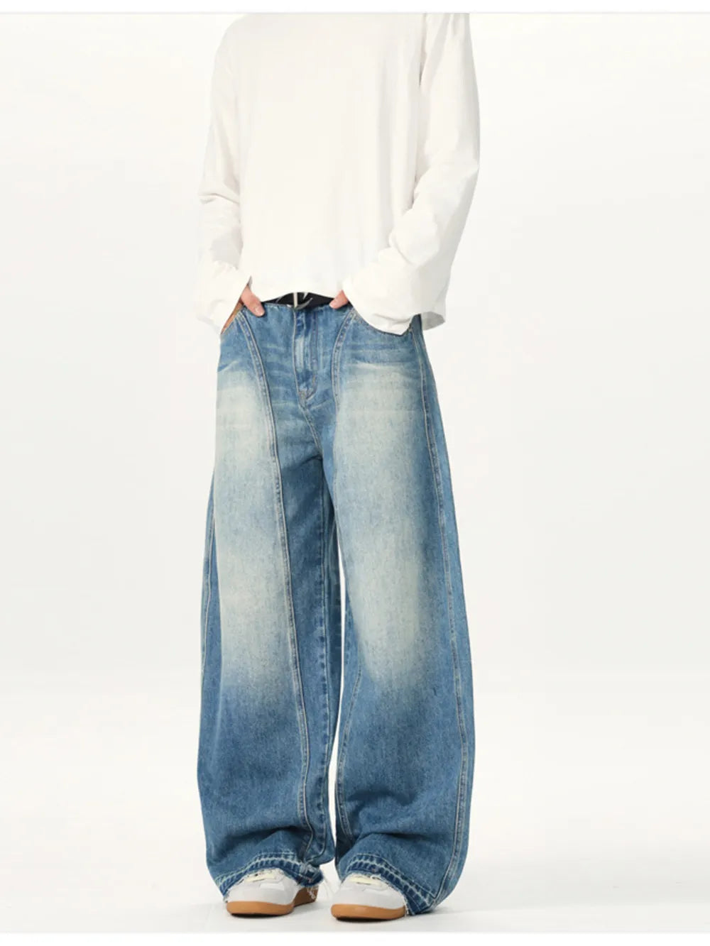 Relaxed fit baggy washed cotton jeans in blue denim with a faded look and wide legs.