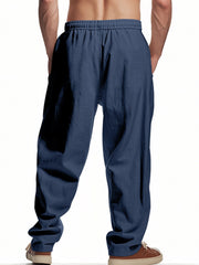 Navy blue drawstring sweatpants with pockets and a relaxed fit.