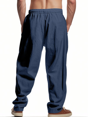Navy blue drawstring sweatpants with pockets and a relaxed fit.