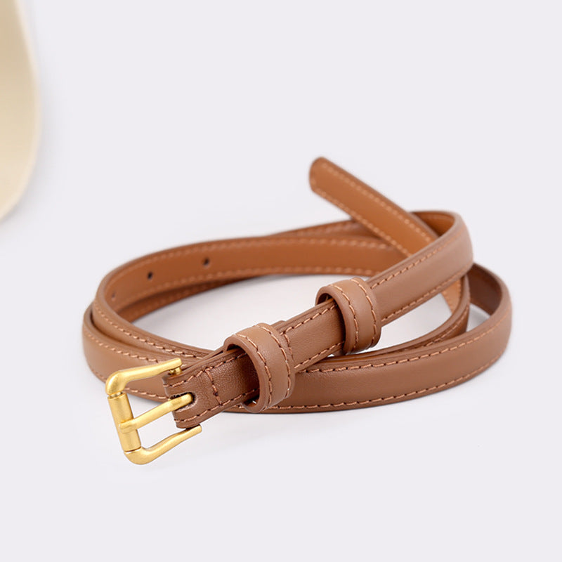 Caramel cowhide leather belt with gold buckle and stitched detail.