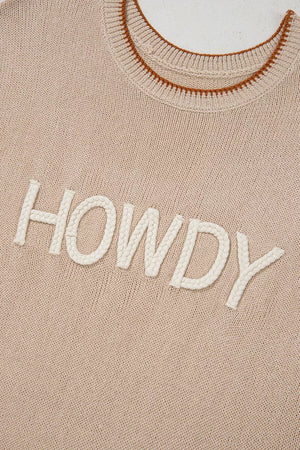 Howdy textured knit sweater vest in beige with braided white lettering and brown trim neckline.