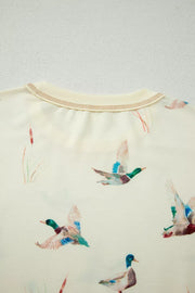Beige crew neck pajama top with a mallard duck print and contrast stitching.