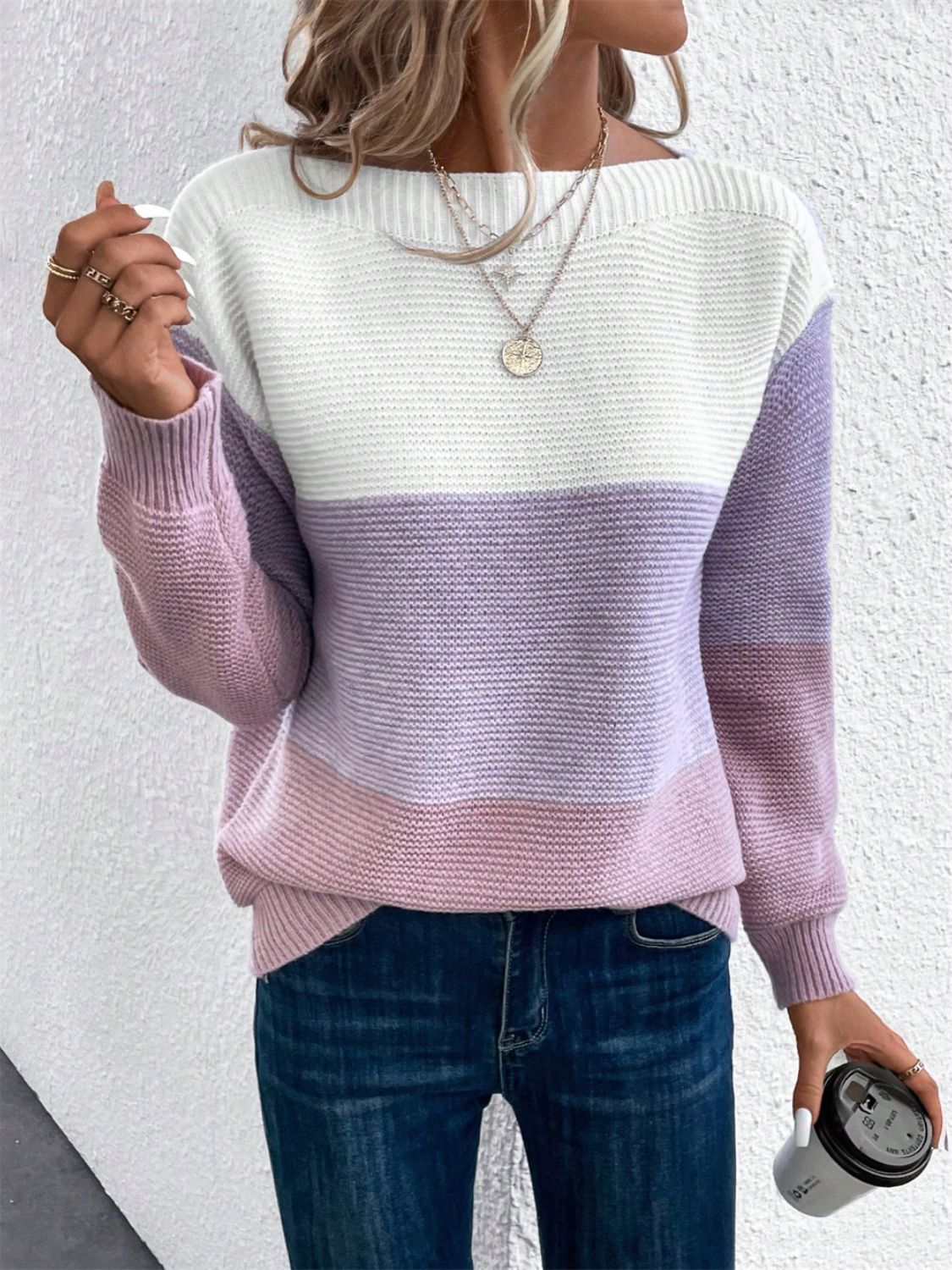 Colorblock boatneck knit sweater in white, lavender, and pink stripes.