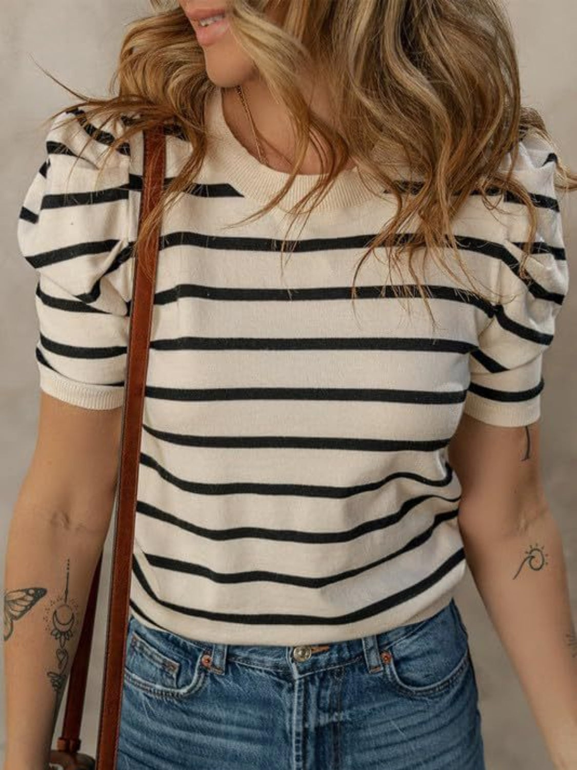 Striped knit tee with puff sleeves in cream and black, crewneck, short sleeves.