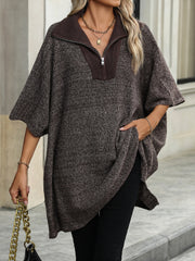 Asymmetric knit zip-neck poncho in coffee brown with short sleeves and a relaxed fit.