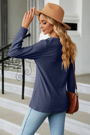 Dark Blue textured henley blouse with button detail and long sleeves.