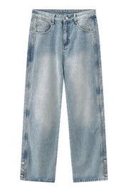 Medium wash baggy denim jeans with snap button hem detail