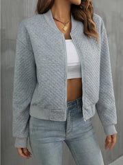 Gray diamond quilted bomber jacket with zipper and ribbed cuffs.