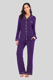 Violet pajama set with piped trim, button-up shirt and pants with pockets.