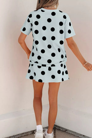 Light blue polka dot two-piece outfit set with crew neck top and mini skirt.
