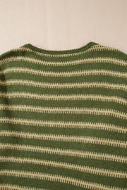 Moss green knit sweater with textured beige stripes and a crew neck.