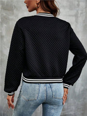 Black quilted bomber jacket with striped ribbing at the collar, cuffs, and hem.
