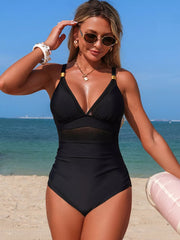 Black one-piece swimsuit with mesh panel detail and gold hardware accents.