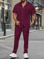 Men's wine red short sleeve button-up shirt and drawstring pants set with subtle check pattern.