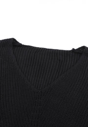 Black relaxed knit V-neck pullover sweater with ribbed texture.