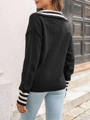 Black knit sweater with varsity stripe collar and cuffs