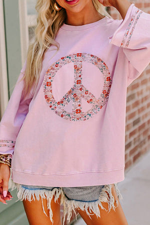 Dusty pink sweatshirt with floral peace sign graphic and embellished sleeves.