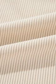 Beige corduroy shacket fabric detail with vertical wales.