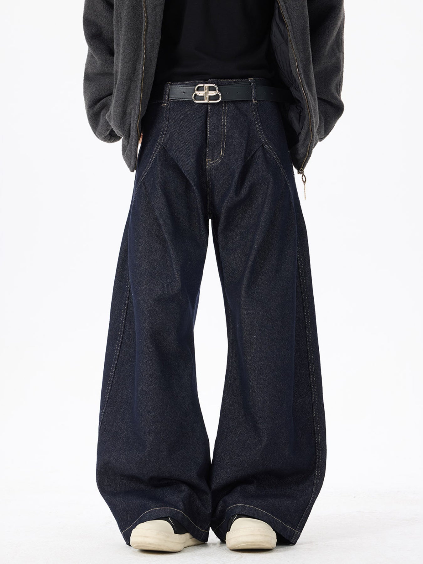 Exaggerated wide-leg dark wash denim jeans with contrast stitching and a relaxed fit.