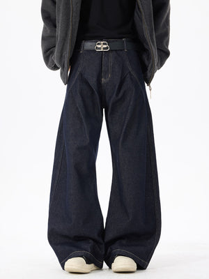 Exaggerated wide-leg dark wash denim jeans with contrast stitching and a relaxed fit.