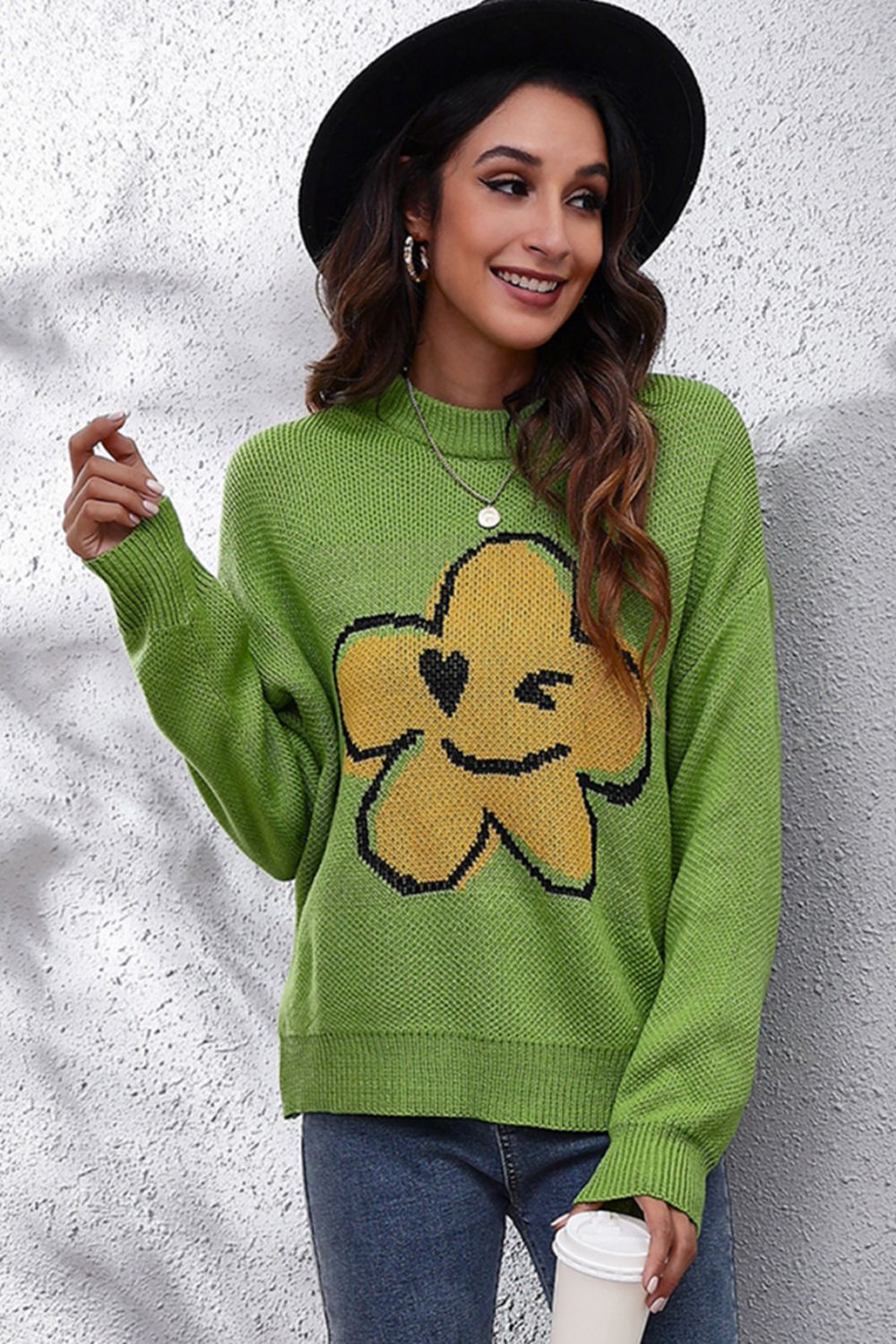 Yellow-green acrylic sweater with a smiley flower intarsia knit design and crew neck.