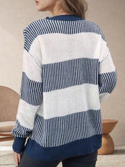 Nautical stripe knit crewneck sweater in dark navy and white, featuring a relaxed fit and ribbed cuffs.