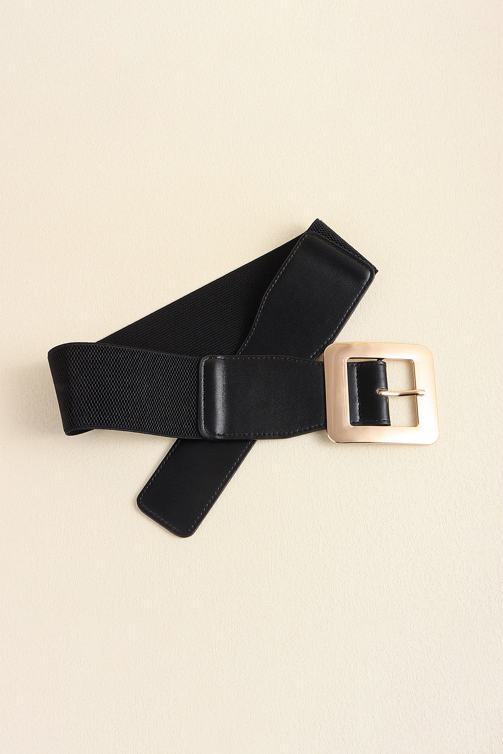 Black vegan leather belt with wide square gold buckle and elastic back.