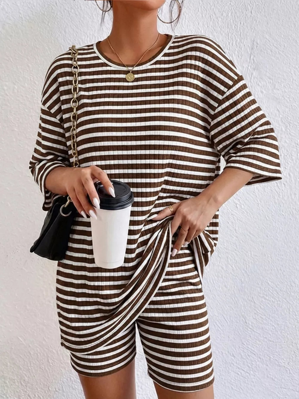 Chic striped two-piece set in coffee stripes with elbow sleeves and shorts.