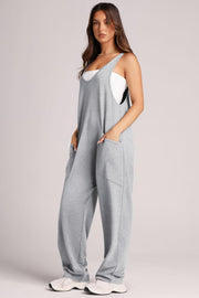 Relaxed fit light gray pocketed tank jumpsuit with wide legs.