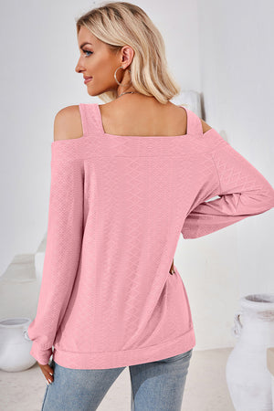 Blush pink geometric cutout shoulder top with a square neckline and long sleeves.