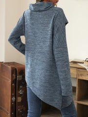 Dusty blue asymmetric knit sweater with cowl neck and long sleeves.
