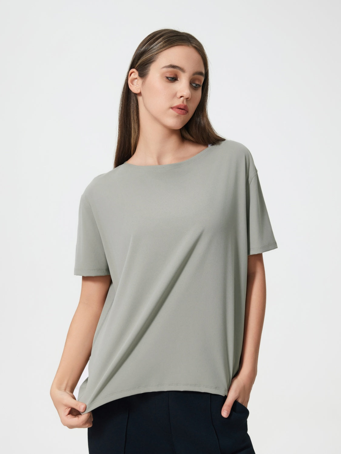 Relaxed fit performance tee in gray with short sleeves and a crew neck.