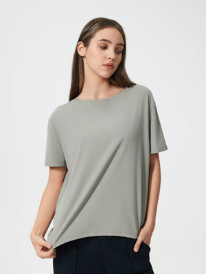Relaxed fit performance tee in gray with short sleeves and a crew neck.