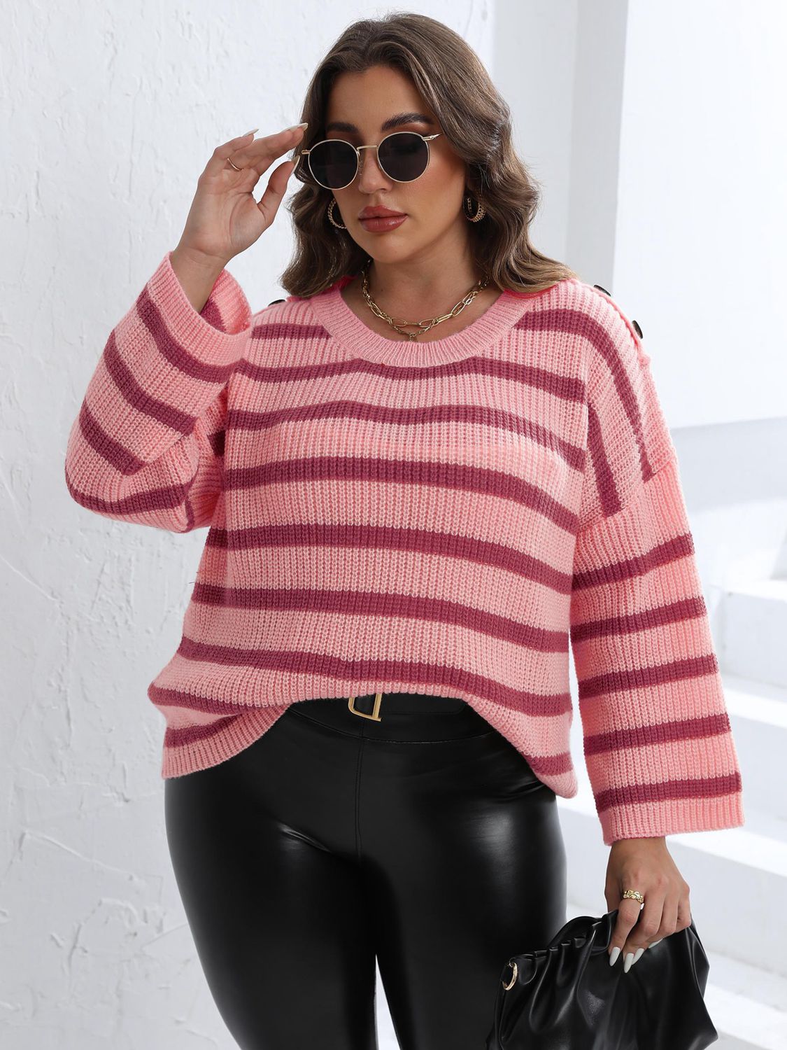 Blush pink and burgundy striped knit sweater with shoulder buttons.