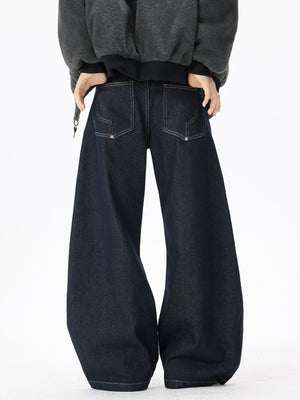 Exaggerated wide-leg dark wash denim jeans with contrast stitching and back pockets.