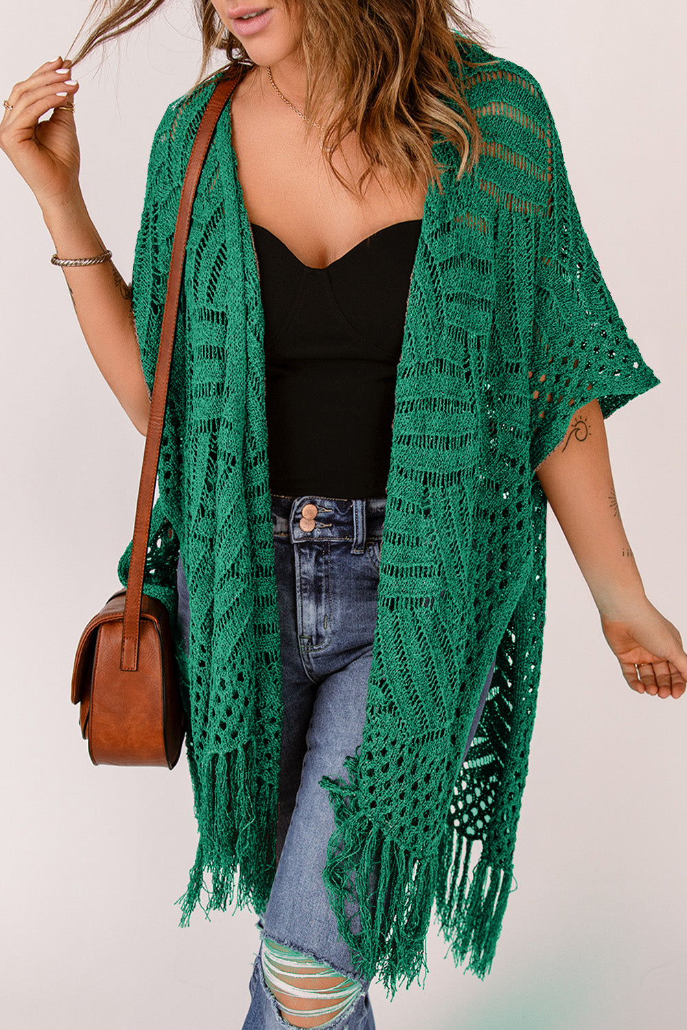Green open knit chevron fringe cardigan with short sleeves and open front.
